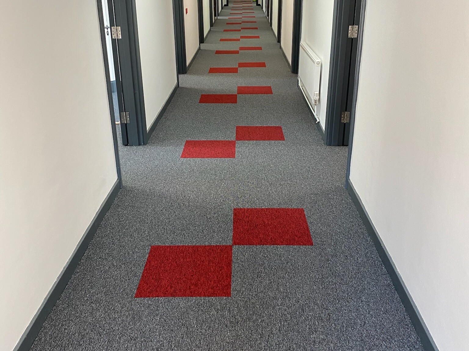 Apartment Hallway with Resilient Carpet Tiles
