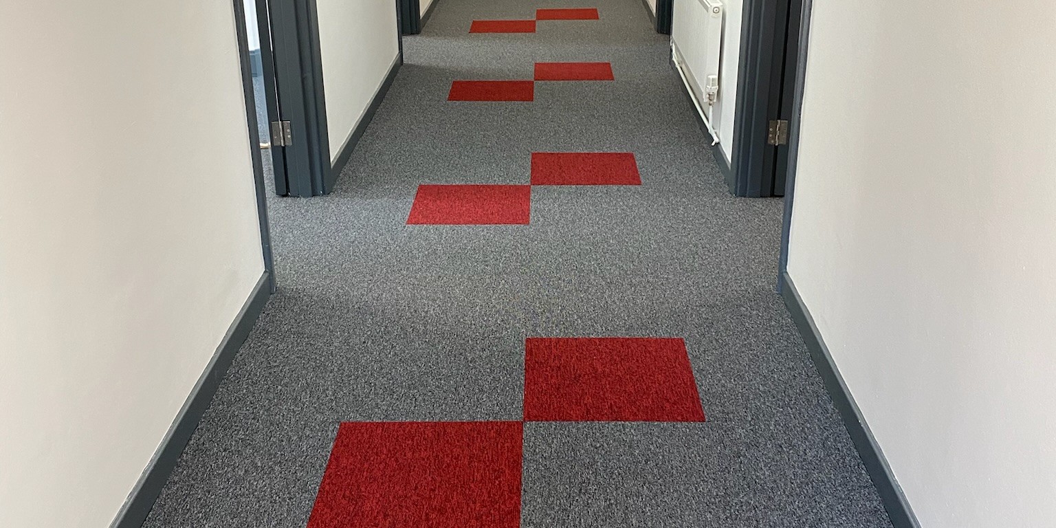 Apartment Hallway with Resilient Carpet Tiles